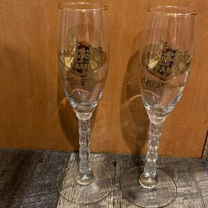 Tropicana Casino vintage gold edged rim and logo champagne flutes. “2000” stems